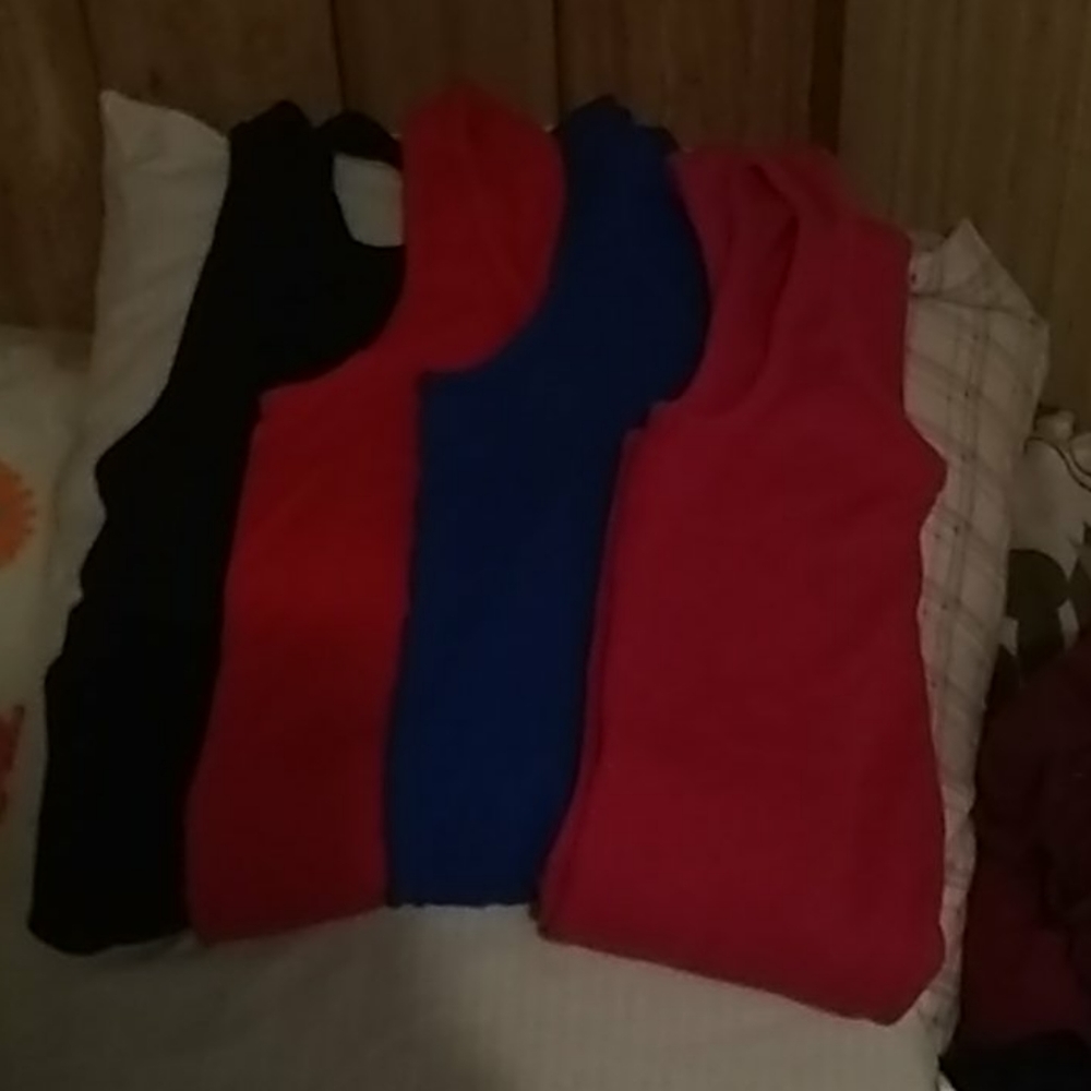 Black, pink, red and blue tank tops